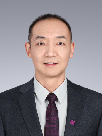 A person in a suit and tie
Description automatically generated